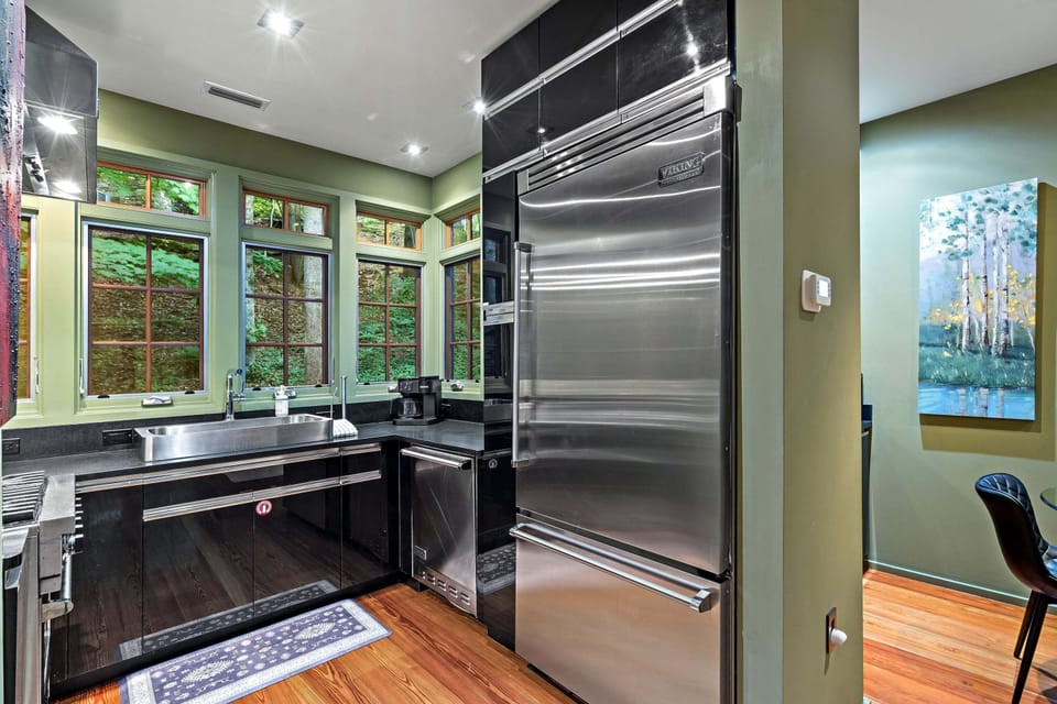 High-end kitchen featuring Viking appliances, dishwasher, and standard drip-style coffeemaker.