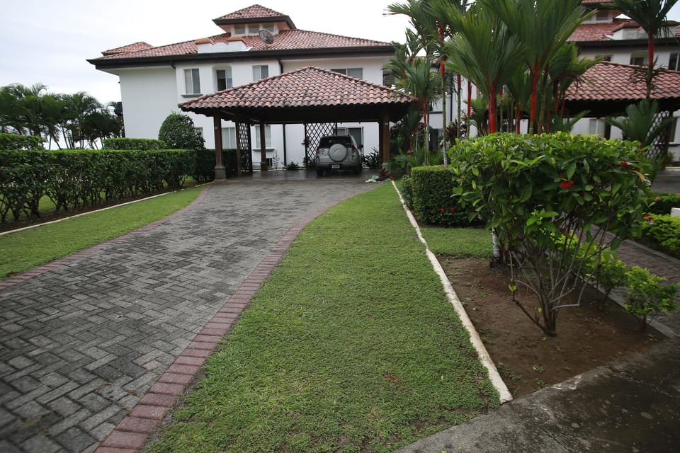 Entrance to Condo showing parking. Condo is whole of the ground floor.