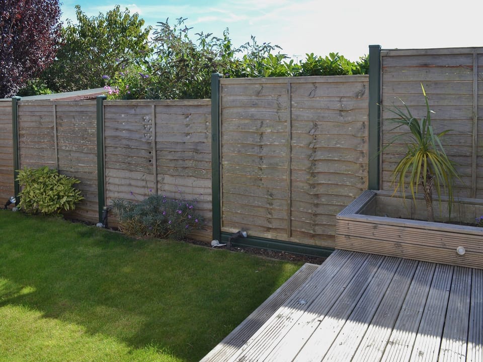 Raised decked area accessd from the living room | Grays Cottage, Bridlington