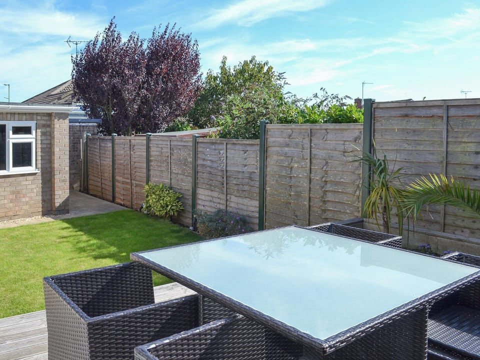 Lovely and sunny outdoor eating area overlooking the garden | Grays Cottage, Bridlington