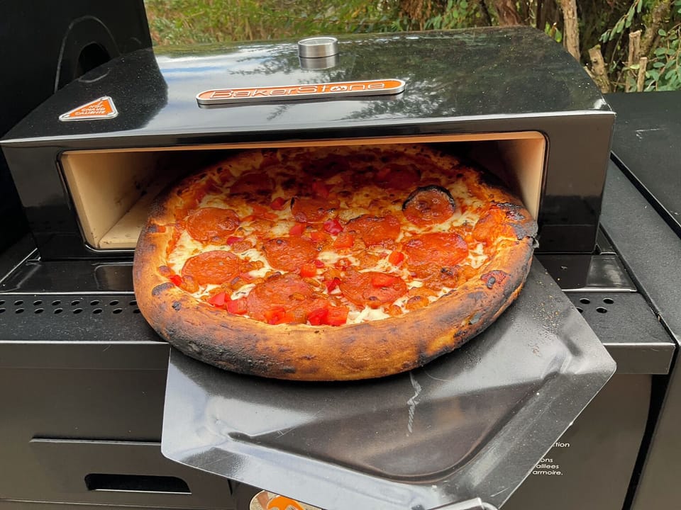 Outdoor pizza nights with the BakerStone pizza oven and provided pizza peel.