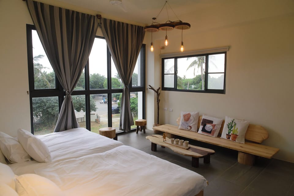 Sea View Squirrel Quad Room | Desk, blackout drapes, bed sheets