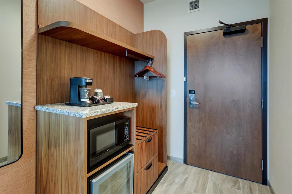 Premium bedding, desk, laptop workspace, blackout drapes
