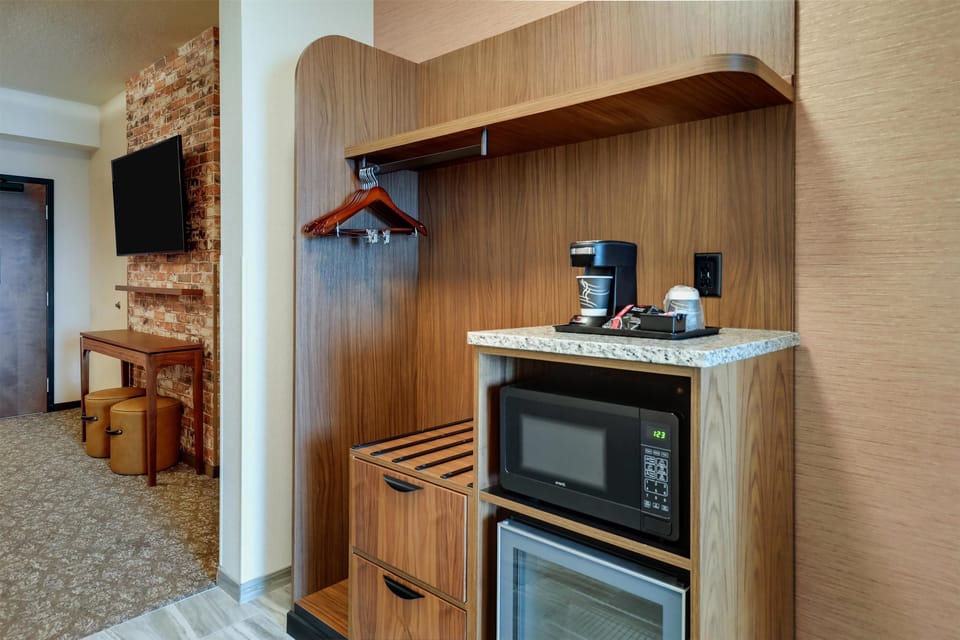 Premium bedding, desk, laptop workspace, blackout drapes