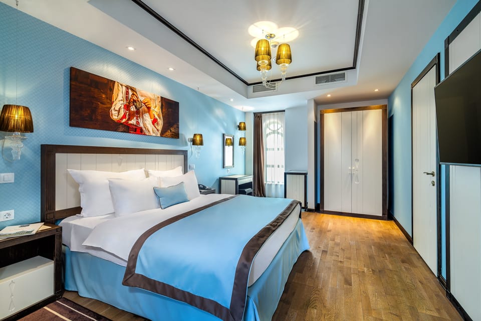 Epoque VIP Suite | Bathroom | Rainfall showerhead, designer toiletries, hair dryer, bathrobes