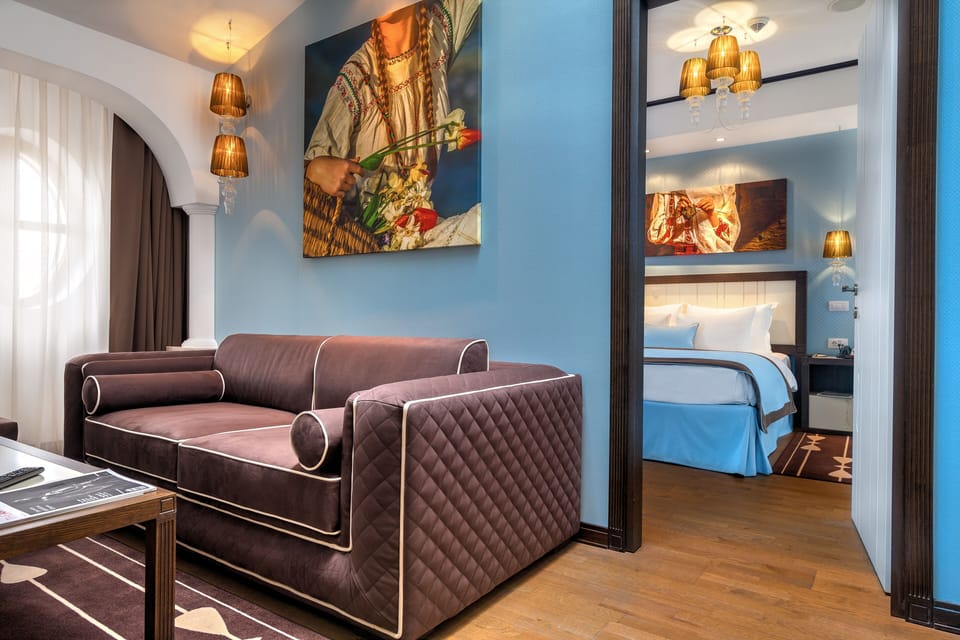 Luxury Suite | Living area | 66-cm plasma TV with digital channels, TV