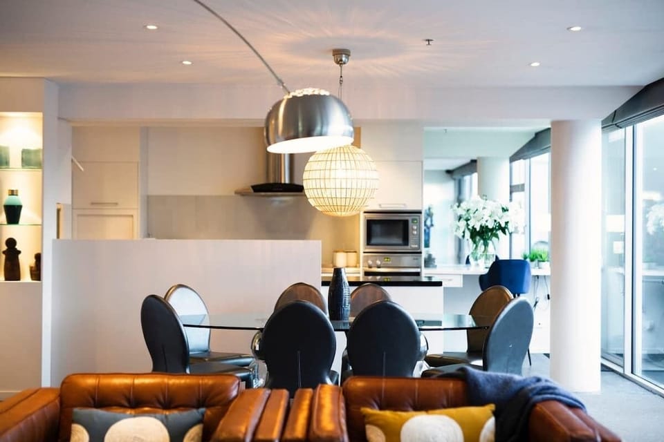 Entertainment lounge, with open flow dining area, kitchen and private spacious balcony.