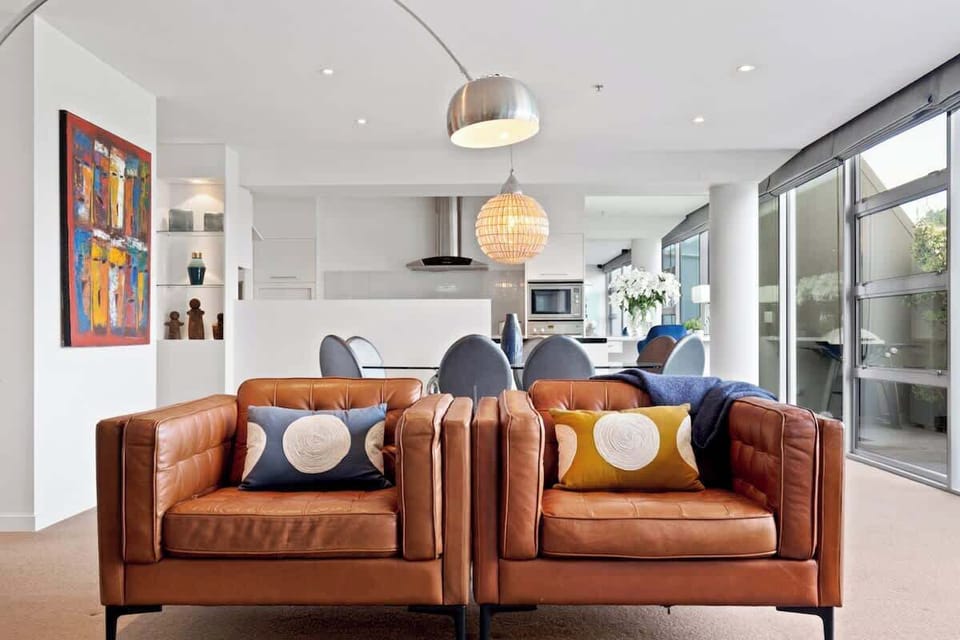 Entertainment lounge, with open flow dining area, kitchen and private spacious balcony.