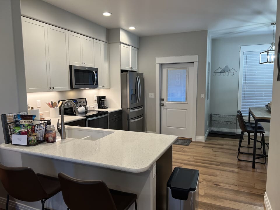 Counter height bar provides additional seating. 