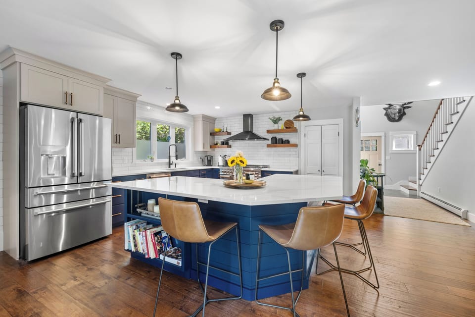 Custom Kitchen with a 6-burner gas range, an open floor plan, and a large island.