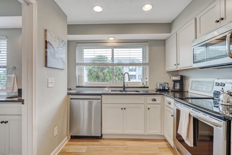 Bright and airy kitchen with all the cooking utensils.