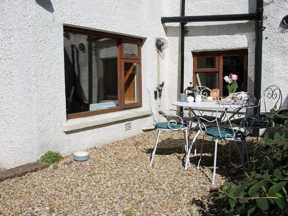 Great private courtyard with garden furniture | Bell Hill Cottage, Lindale, near Grange-over-Sands