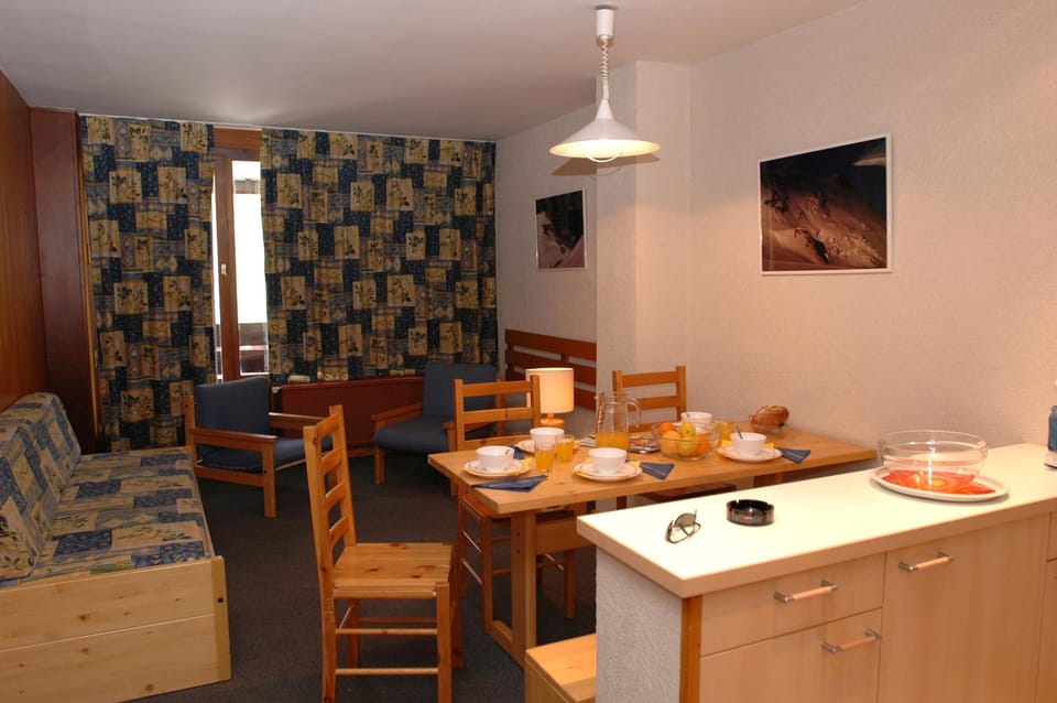 Prepare meals in the kitchenette and enjoy them at the dining table.