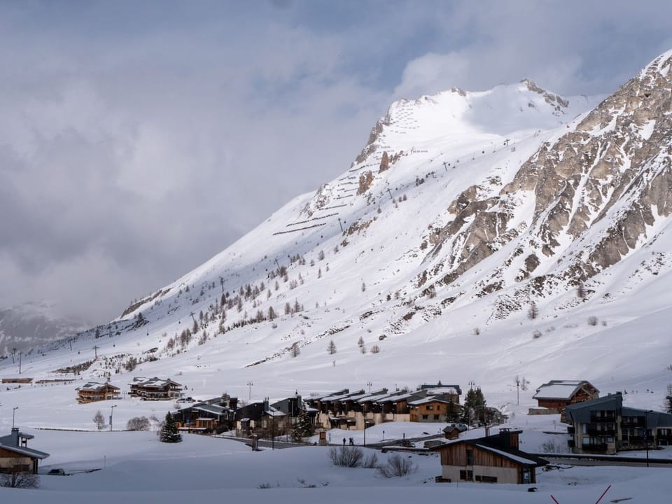 A snow-blanketed village at the foot of the peaks in Tignes, French Alps
