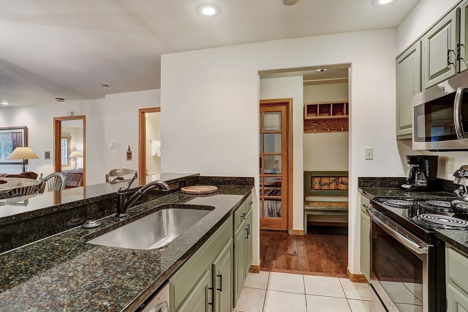 Condo, 2 Bedrooms | Private kitchen | Fridge, microwave, oven, dishwasher