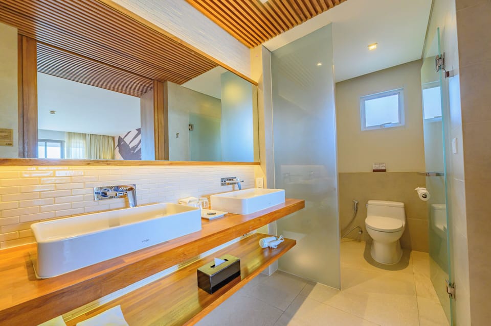 Designer toiletries, hair dryer, bathrobes, slippers