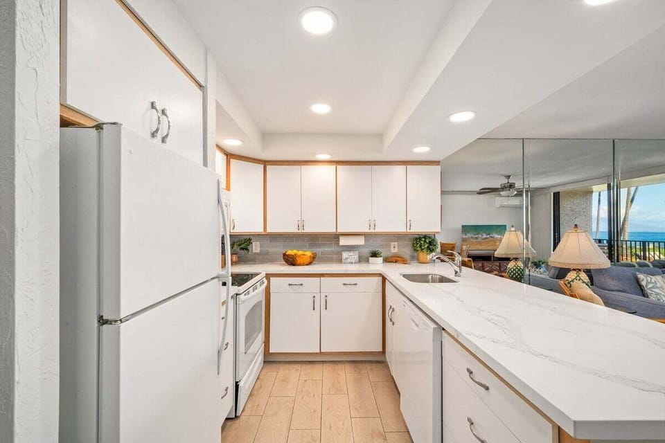 Full kitchen with granite countertops and views of the ocean