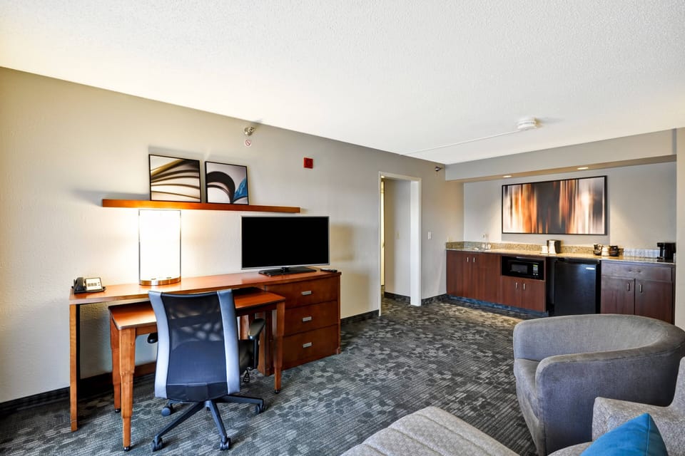 Executive Suite, 1 Bedroom, Corner | Living area | LCD TV