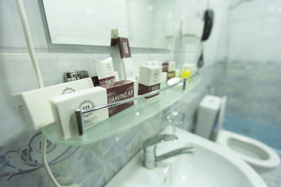 Designer toiletries, hair dryer, bathrobes, slippers