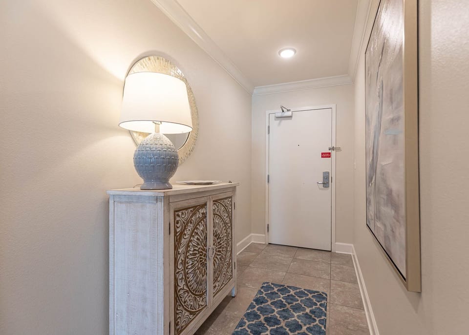 Step inside to discover a serene entryway, inviting you to start your beach getaway with stylish decor