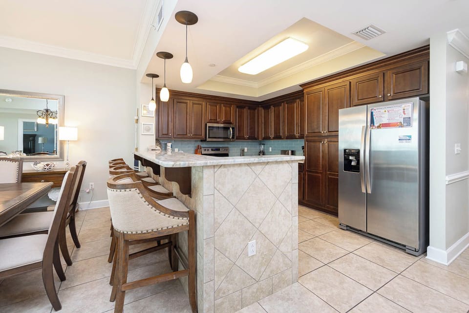 Experience the joy of waking to morning coffee at the breakfast bar, with inviting seating for casual dining
