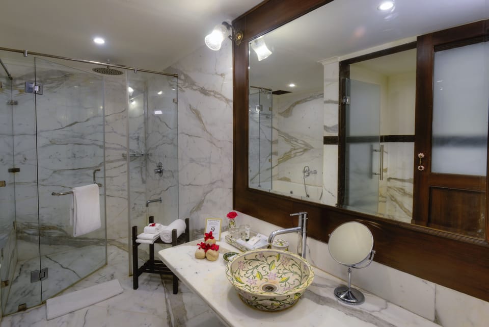 Luxury Studio Suite, Non Smoking, Pool View | Bathroom | Shower, rainfall showerhead, free toiletries, hair dryer (on request)