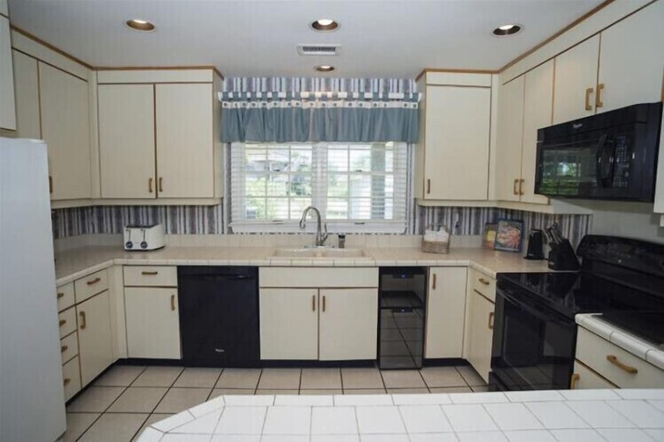 Cook your favorite meals in this spacious, well-equipped kitchen, complete with modern appliances, plenty of counter space, and everything you need to feel right at home.