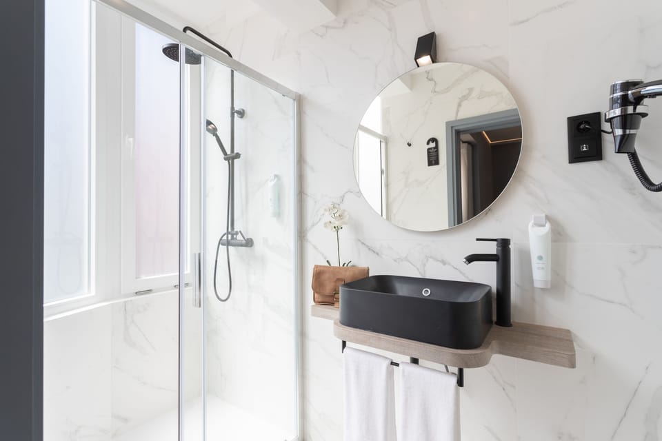 Suite (105) | Bathroom | Shower, designer toiletries, hair dryer, towels