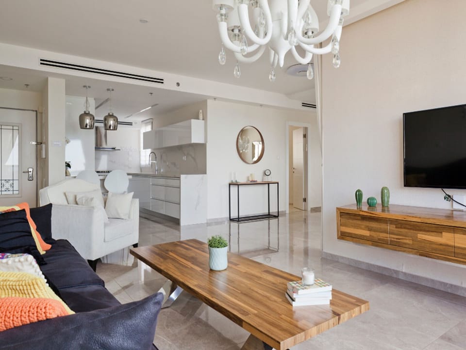 Luxury Apartment | Living area | 50-inch plasma TV with cable channels, TV
