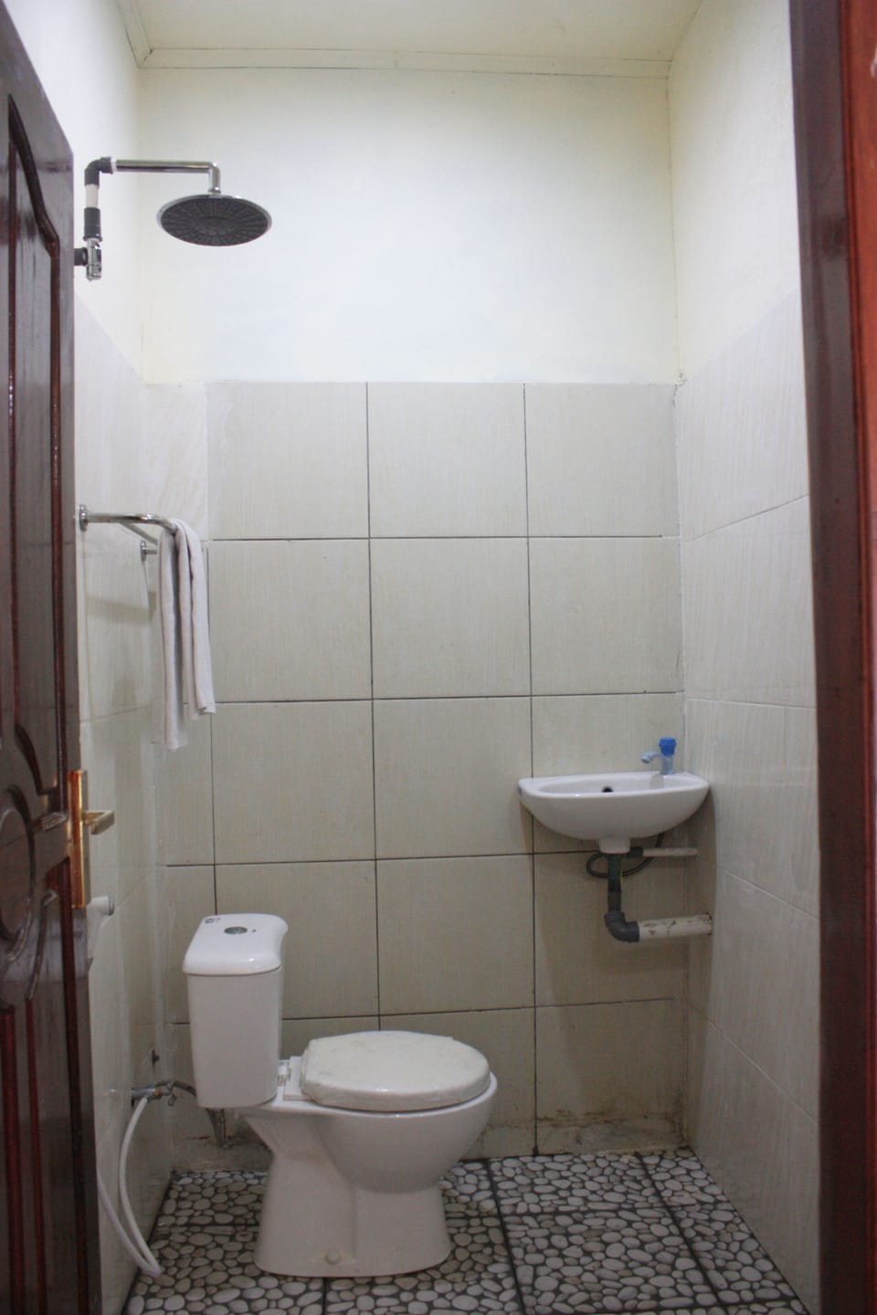 Shower, rainfall showerhead, slippers, towels