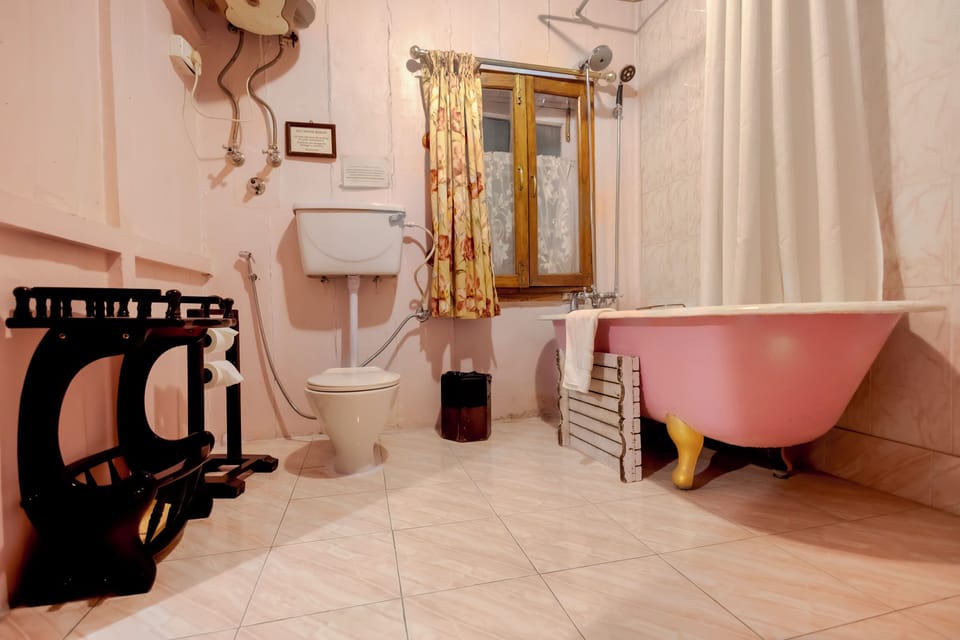 Separate tub and shower, rainfall showerhead, free toiletries