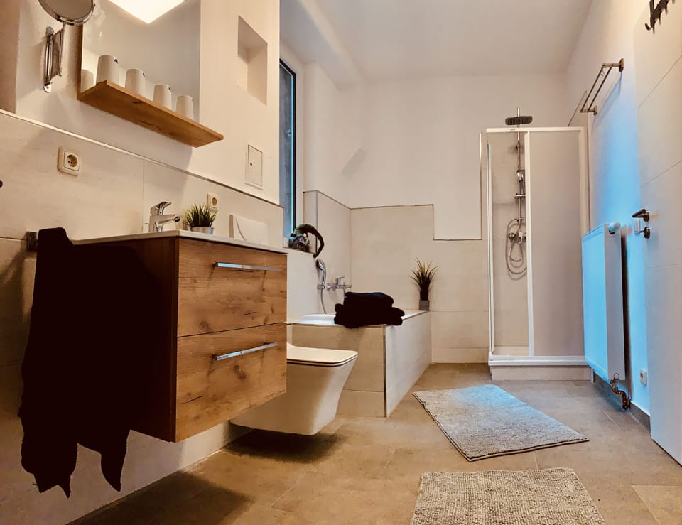 Exclusive Apartment, 2 Bedrooms, Ground Floor | Bathroom | Separate tub and shower, deep soaking tub, hair dryer, towels