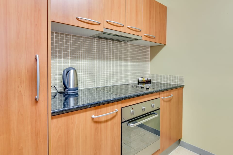 Apartment, 2 Bedrooms | Private kitchen | Coffee/tea maker, electric kettle, toaster, dining tables
