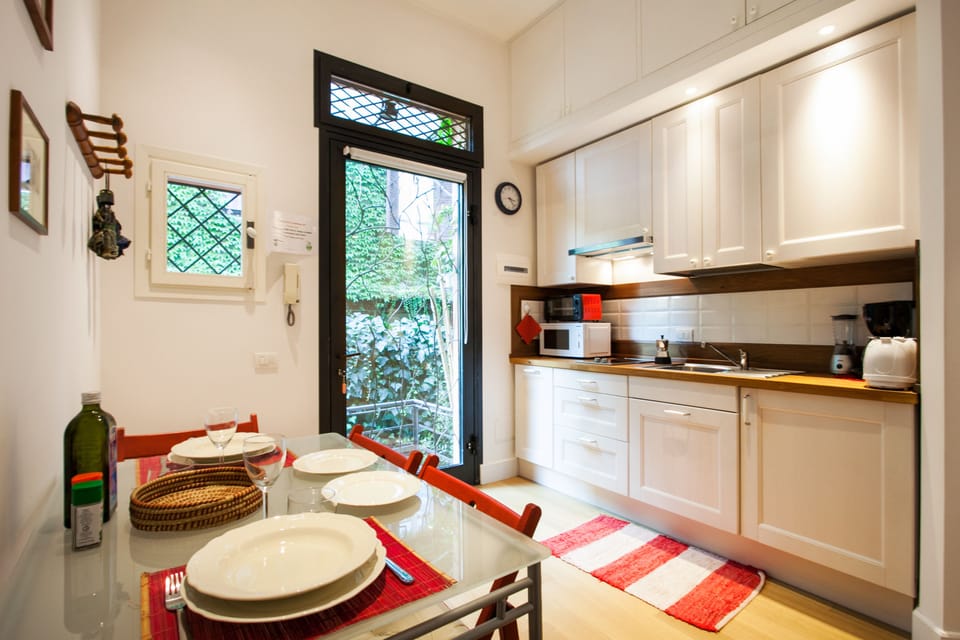 Apartment, 1 Bedroom | Private kitchen | Full-size fridge, microwave, stovetop, coffee/tea maker