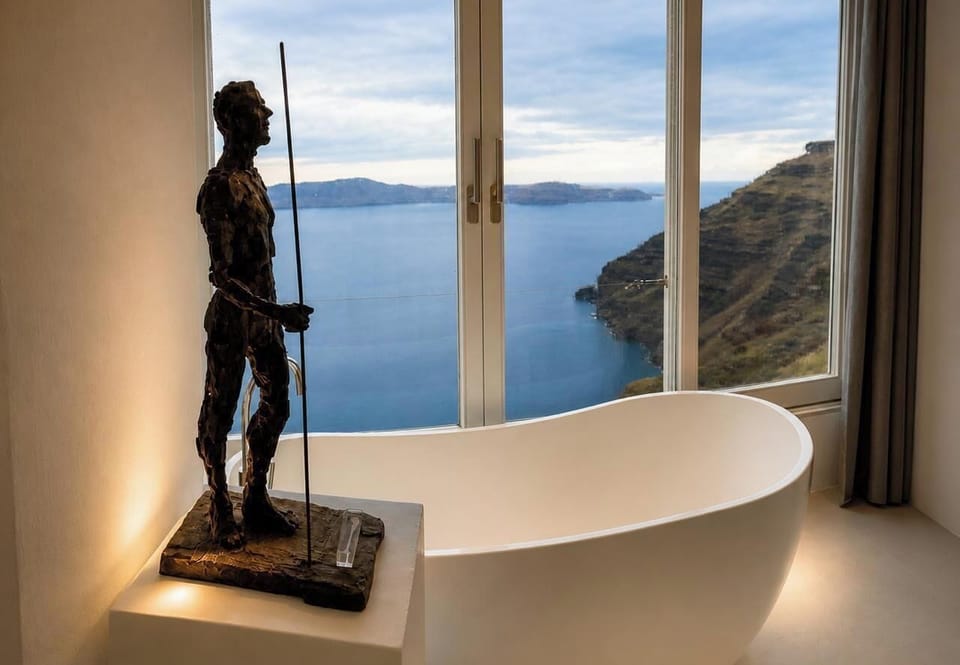 Sun Rocks Experience Suite with indoor Hot Tub, Caldera & Sea View | Pillowtop beds, minibar, in-room safe, desk