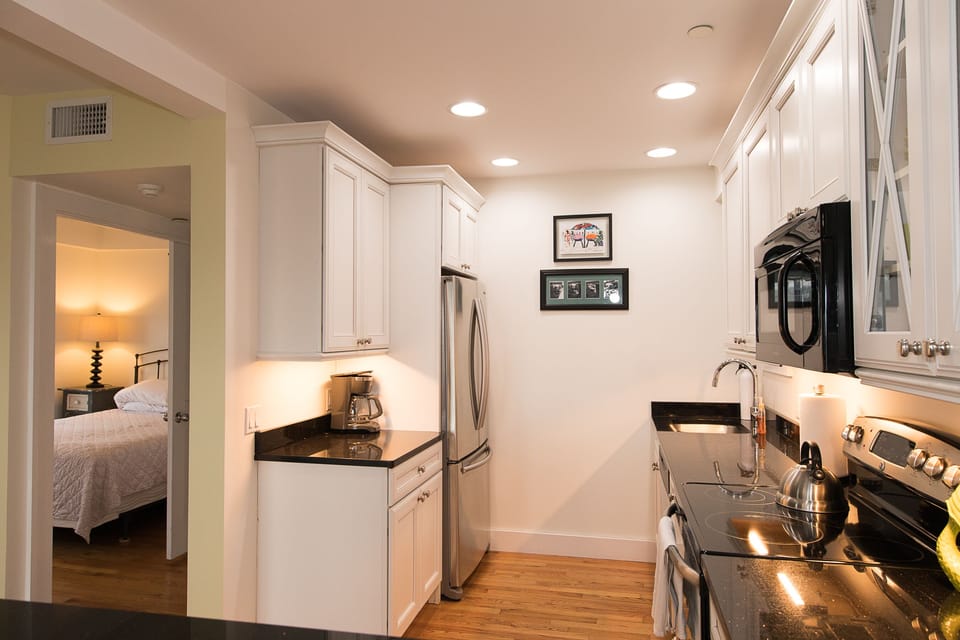 Full kitchen with coffee maker and complimentary coffee.