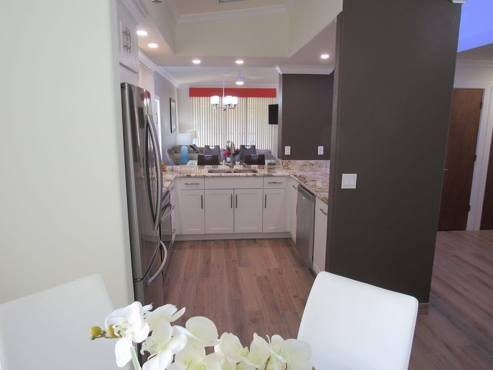 View of the kitchen from the breakfast table. 