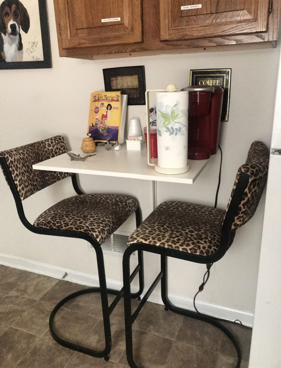 Breakfast bar in kitchen with kureg coffee maker and coffee