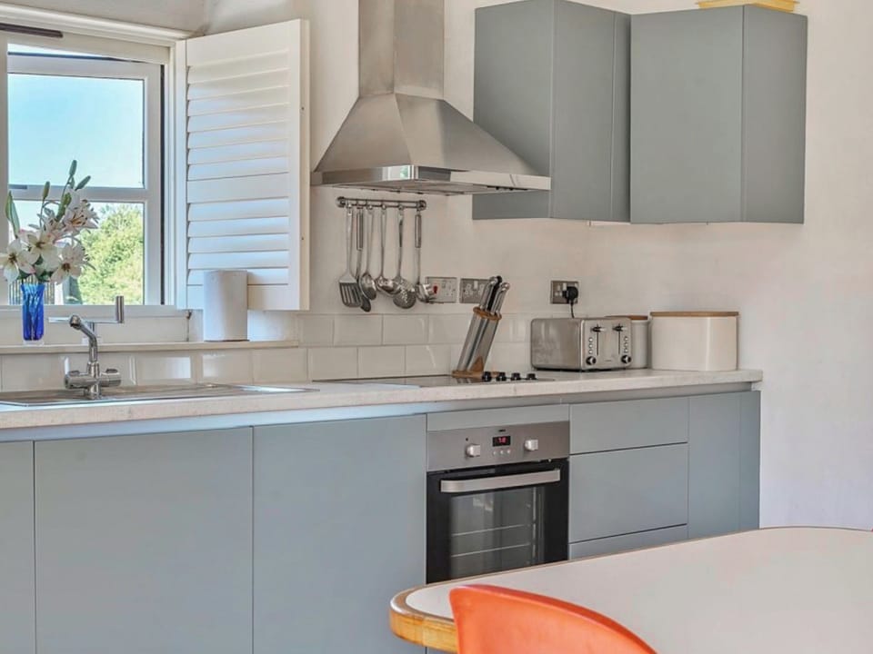 Kitchen in open plan living space | Moderno - Tregrill Farm Cottages, Menheniot, near Liskeard