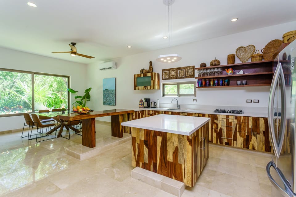 Large spacious fully equipped kitchen, with island, and separate pantry