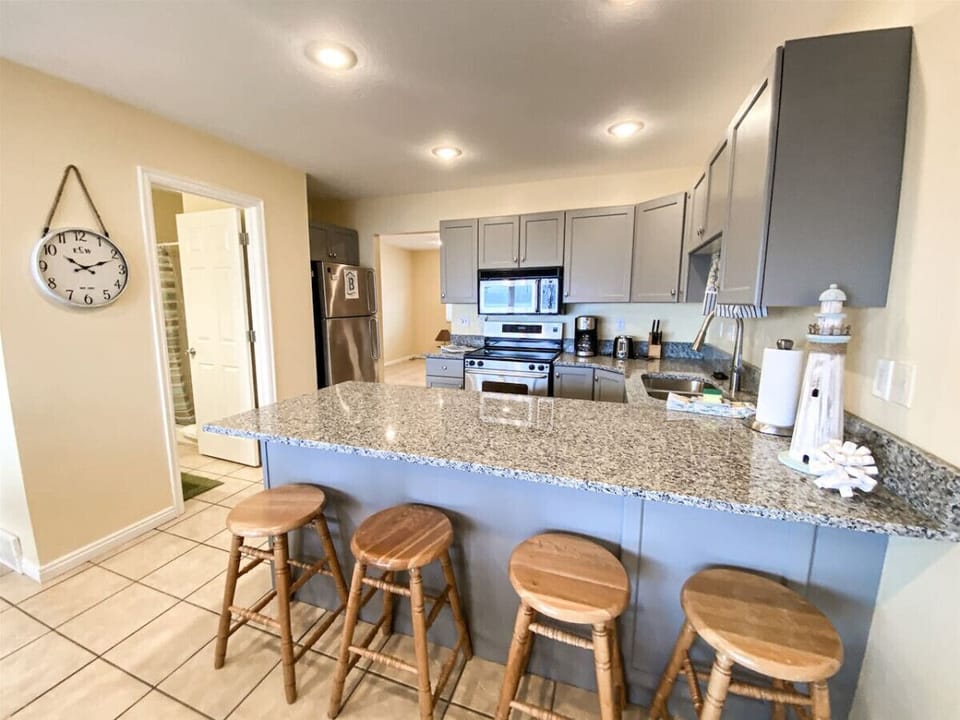 Open kitchen bar seating perfect for gathering and snacks