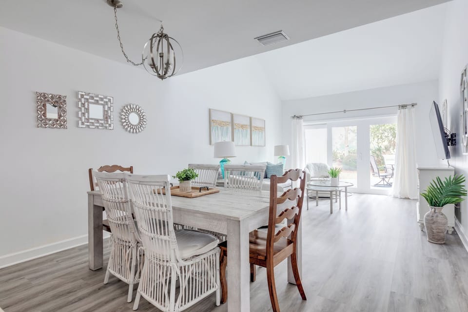 Dining area with additional seating at the counter and outdoor patio.