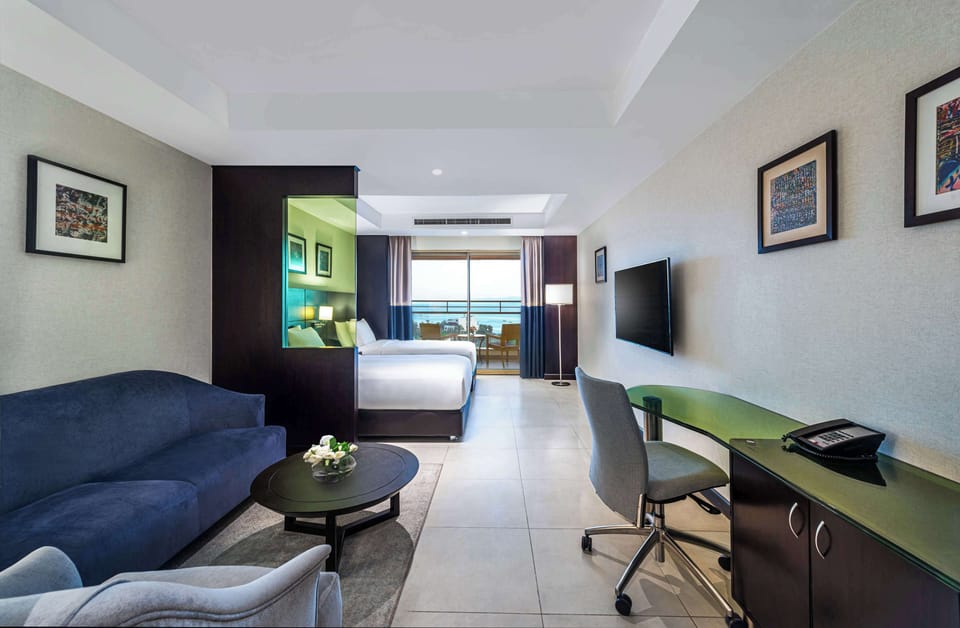 Twin Junior Suite with Sea View | Living area | 43-inch LCD TV with satellite channels, TV