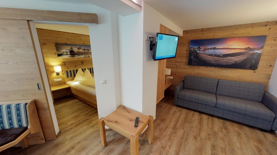 Comfort Apartment | Living room | 30-inch flat-screen TV with digital channels, TV, heated floors