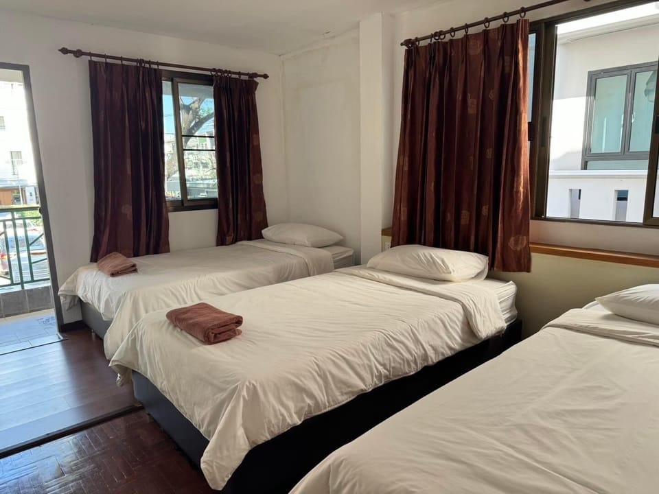 Deluxe Triple Room, Non Smoking, Garden View | Premium bedding, blackout drapes, free WiFi, bed sheets