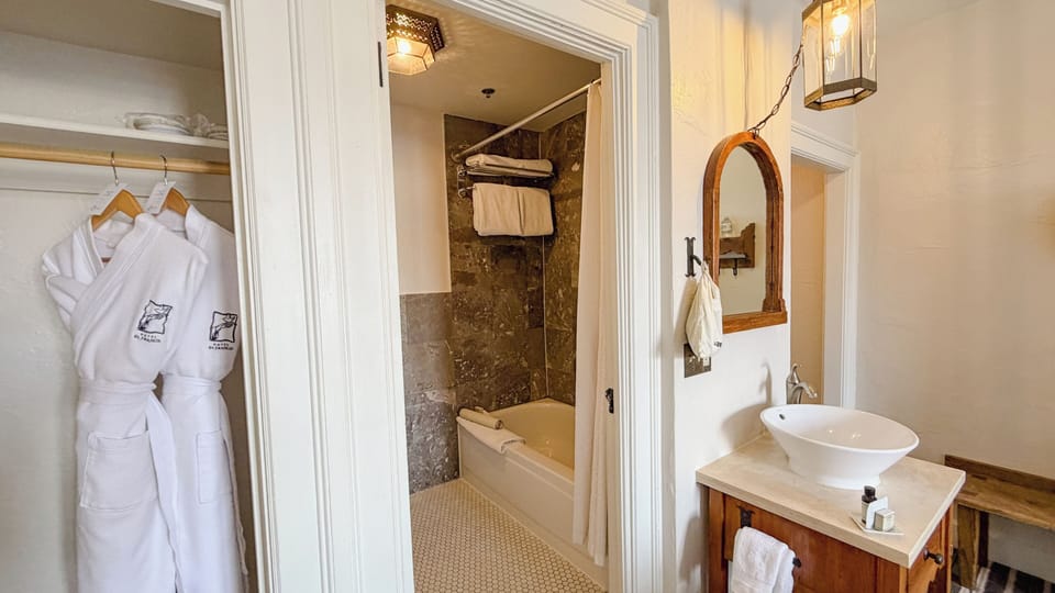 Designer toiletries, hair dryer, towels