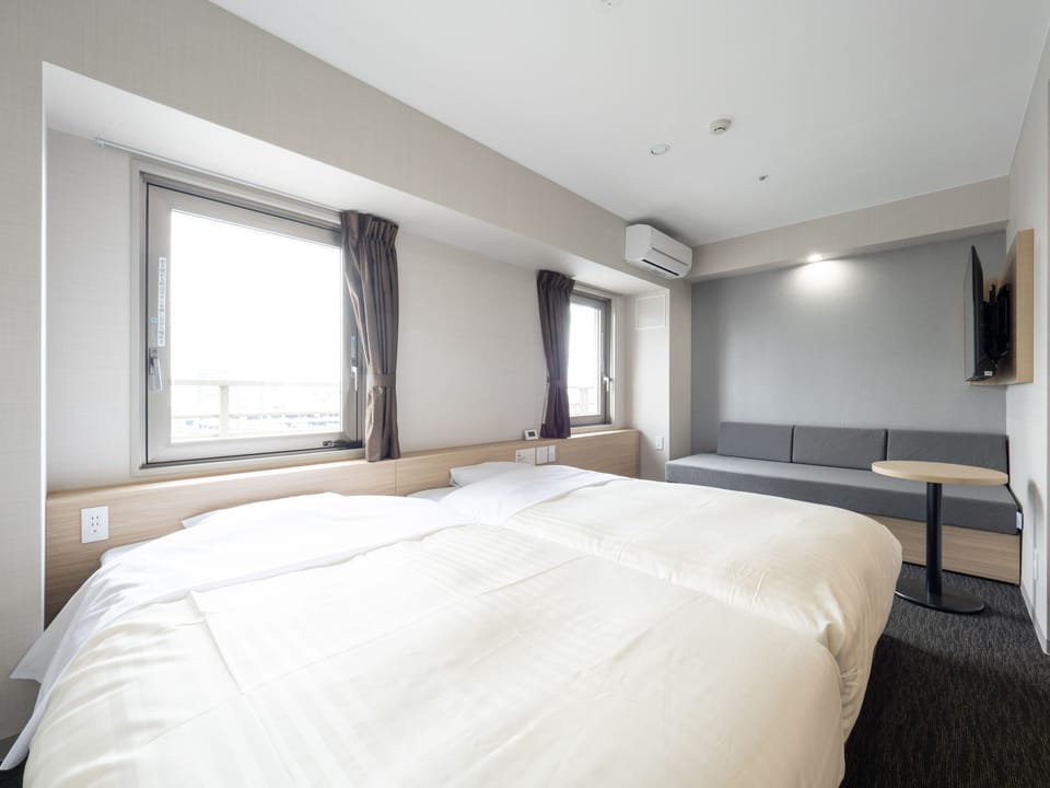 Twin Room, Non Smoking (B type) | Desk, blackout drapes, soundproofing, iron/ironing board