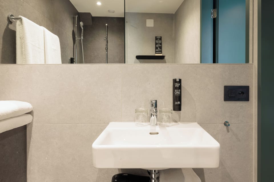 Shower, eco-friendly toiletries, hair dryer, towels