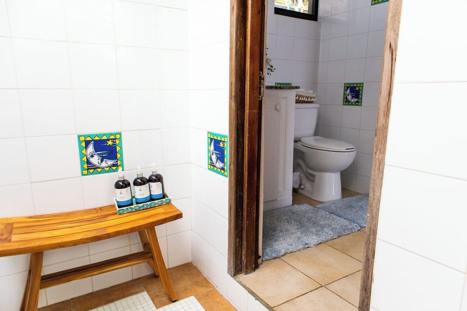 Bright and airy bathroom with natural light and refreshing shower.