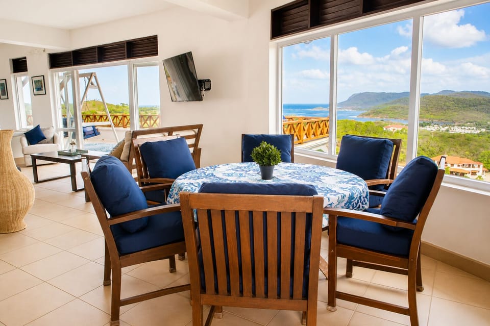 Large open plan living & dining room which opens up to a large patio with gorgeous views and cooling breezes.